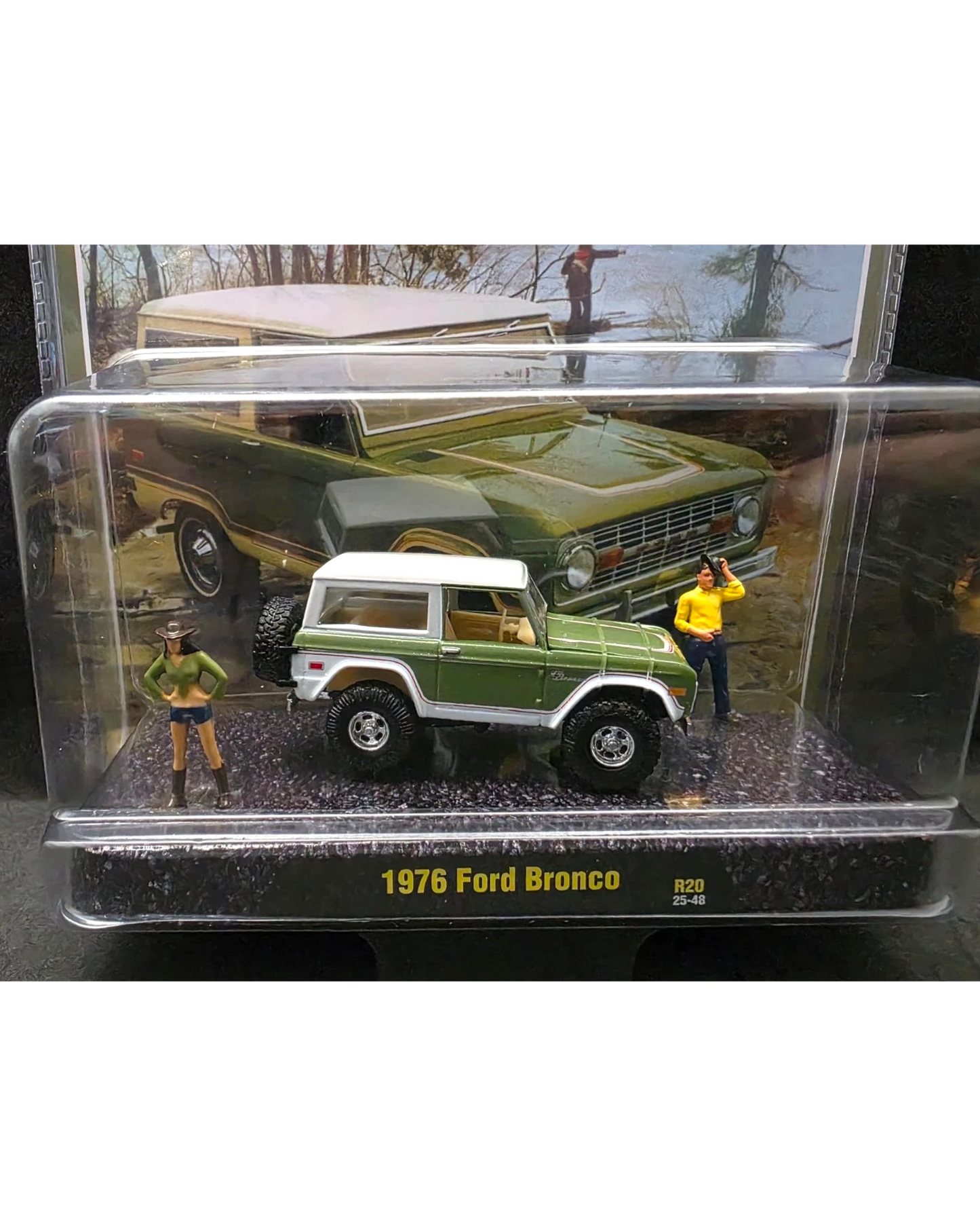 More Than Diecast 1:64 scale 1976 Ford Bronco diorama set with two figures in a clear display case