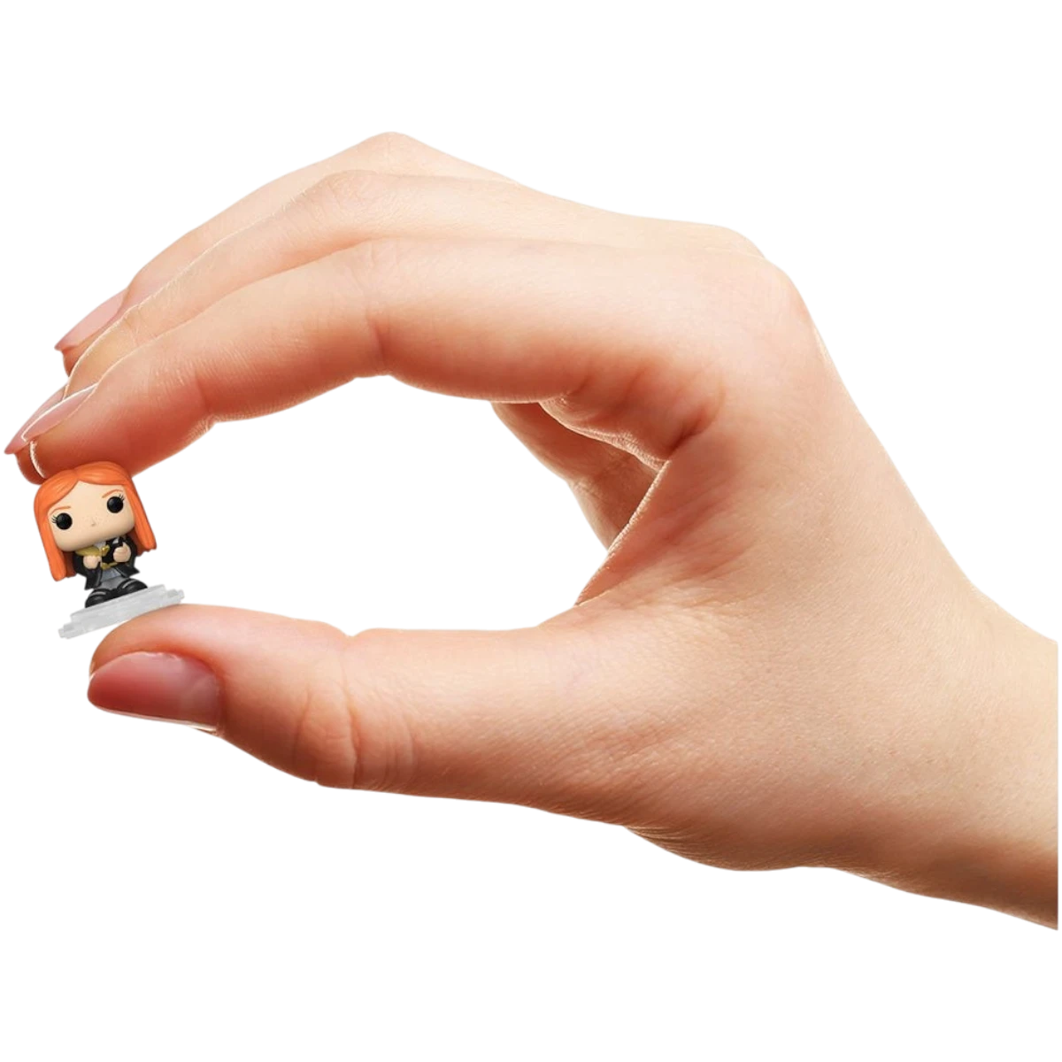 More Than Diecast Funko Bitty Pop! Ginny Weasley mini-figure held between fingers to show its small 1-inch scale.