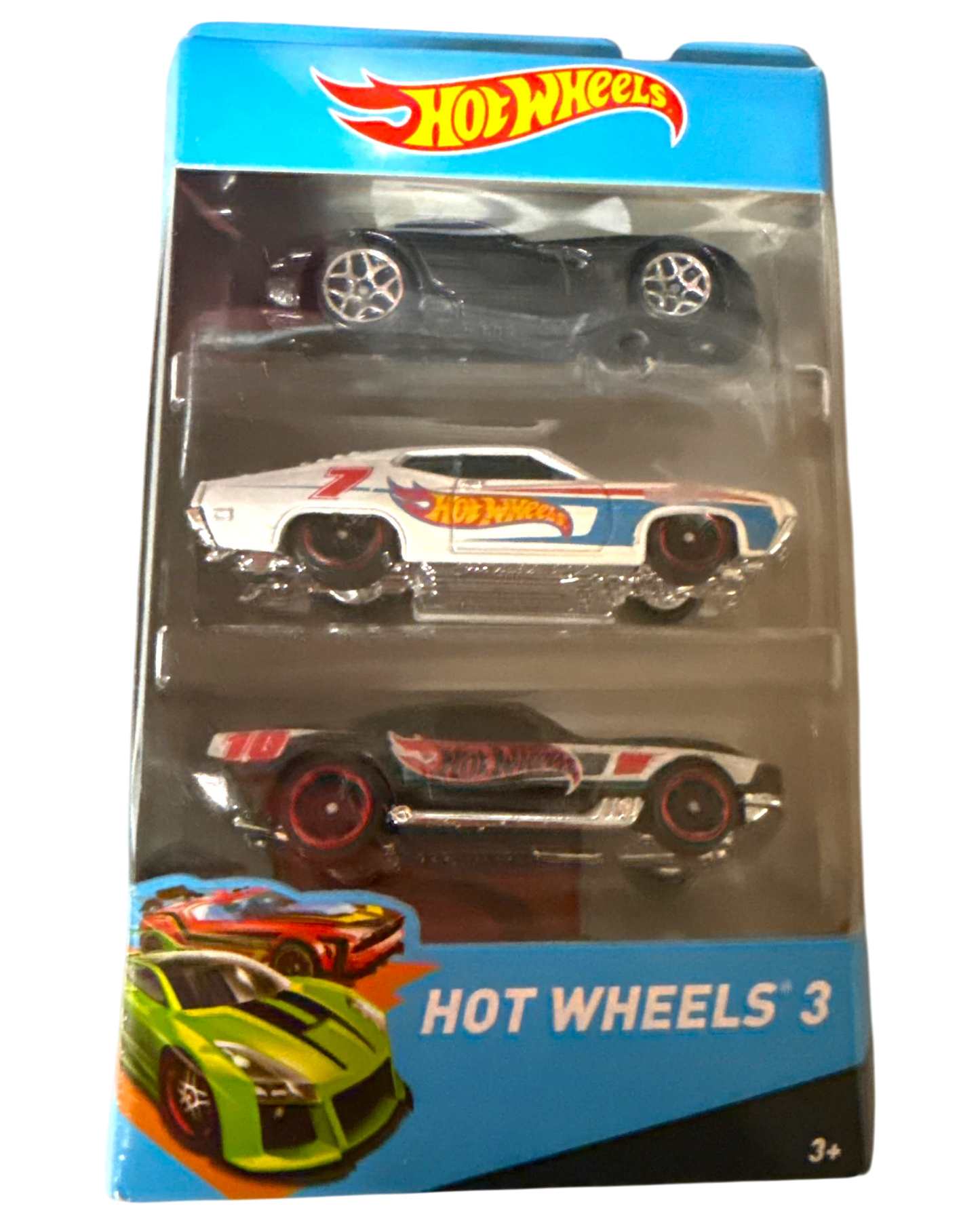 More Than Diecast Hot Wheels 3-pack featuring a black sports car, a white muscle car with red and blue accents, and a black and red muscle car.
