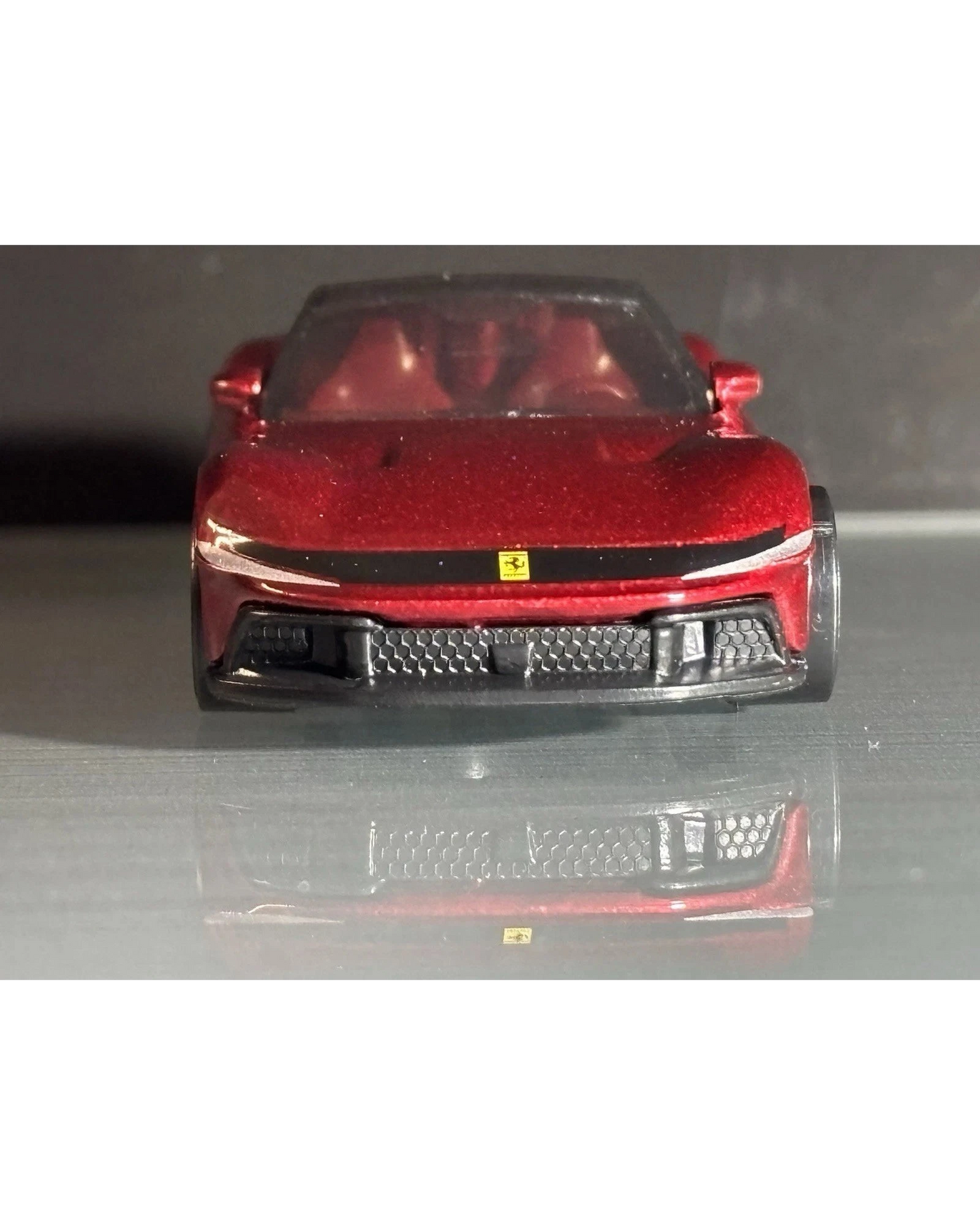 More Than Diecast Hot Wheels Ferrari 12 Cilindri in metallic red, front view of 1:64 scale die-cast model car.
