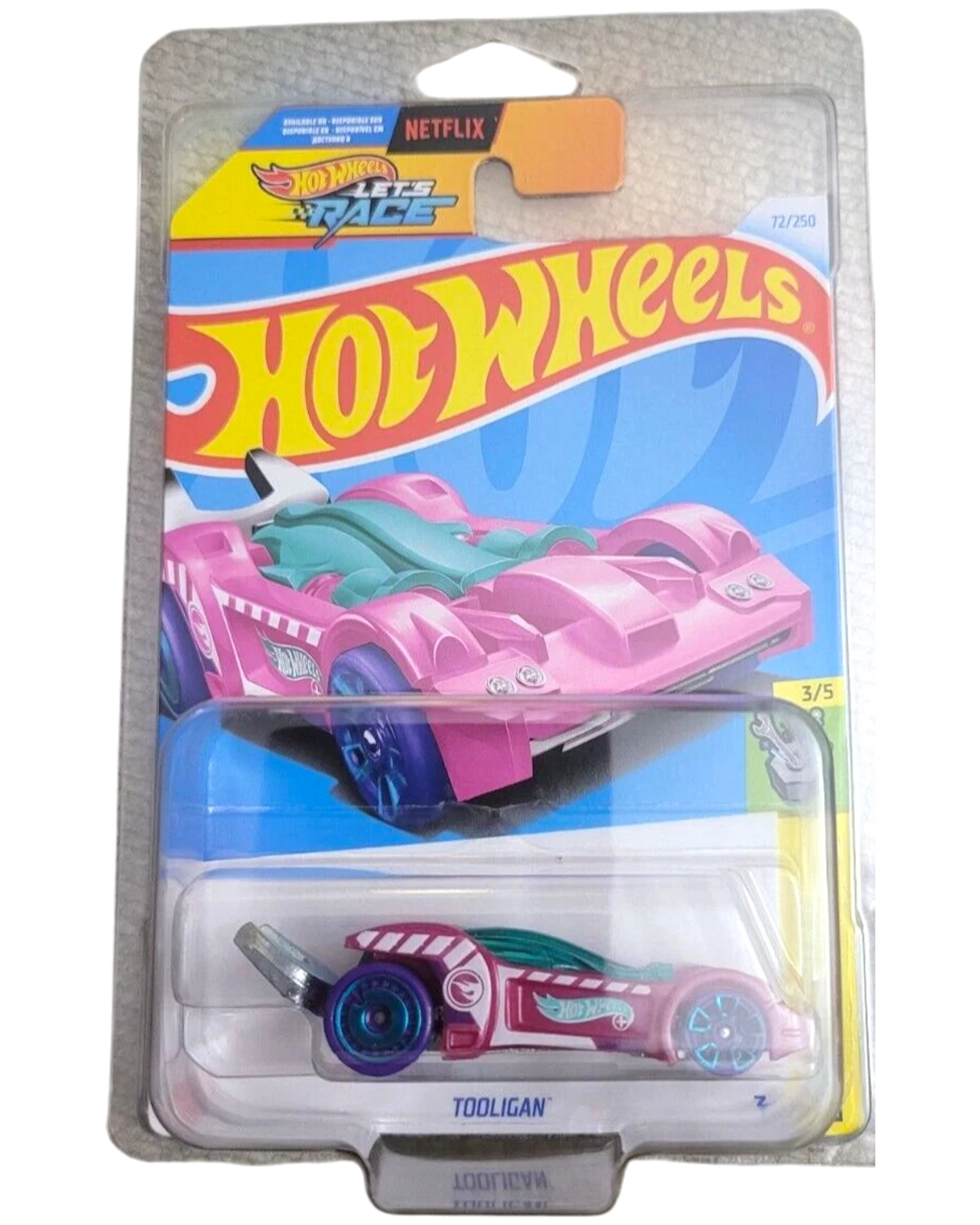 More Than Diecast Hot Wheels Tooligan Treasure Hunt die-cast car in pink and teal with flame graphics on blister card