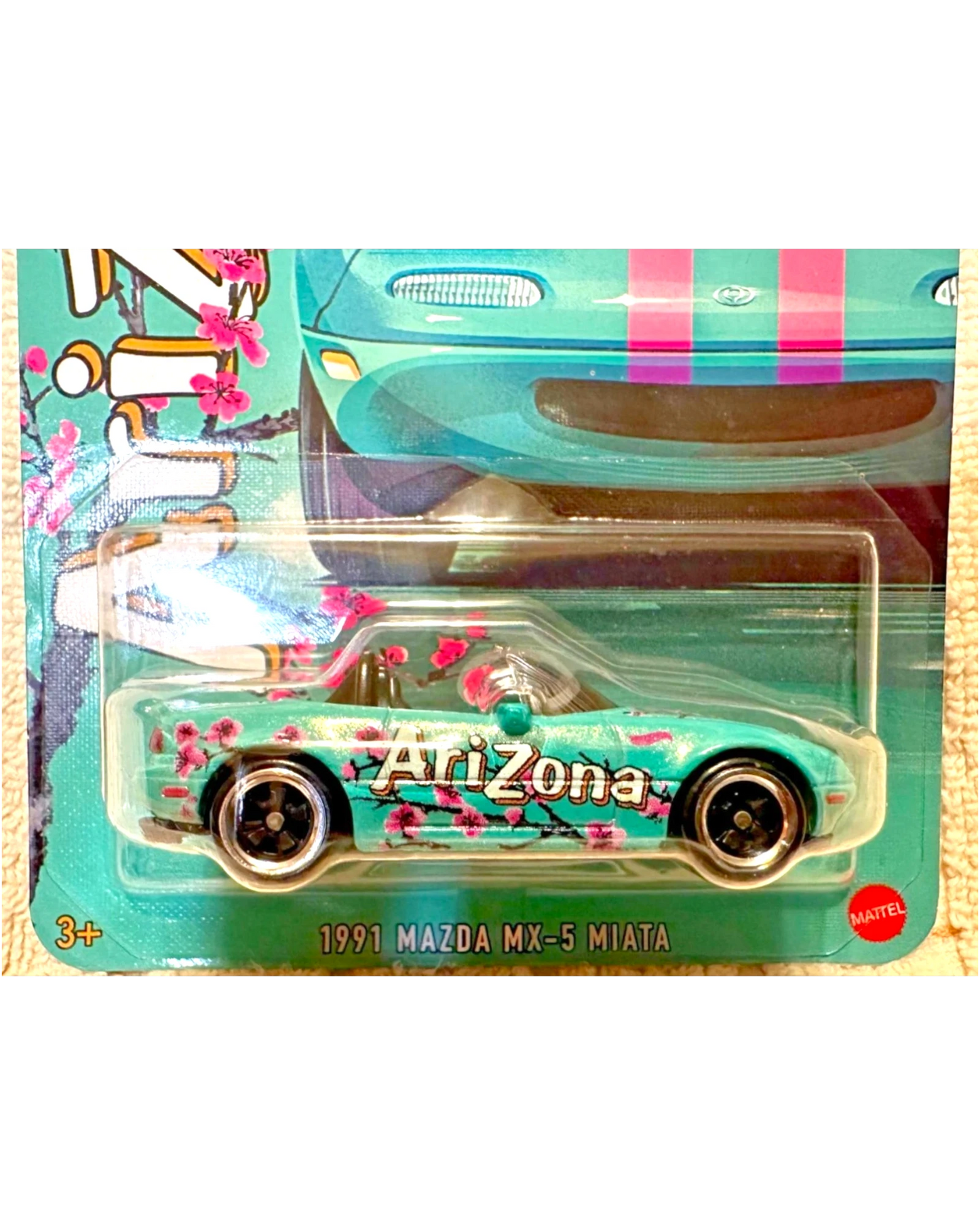More Than Diecast Hot Wheels 1991 Mazda MX-5 Miata featuring teal Arizona Iced Tea livery with cherry blossom art