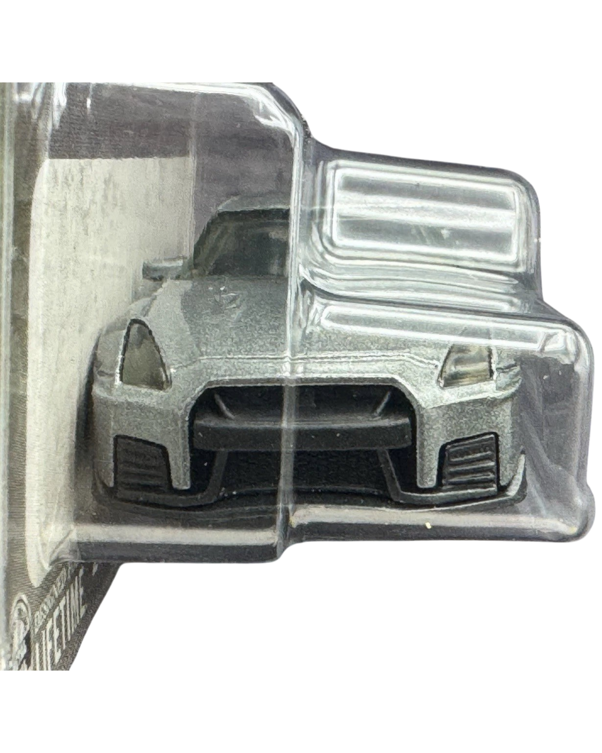 More Than Diecast 1:64 scale 2020 Nissan GT-R Nismo die-cast car in black, front view in original blister packaging.