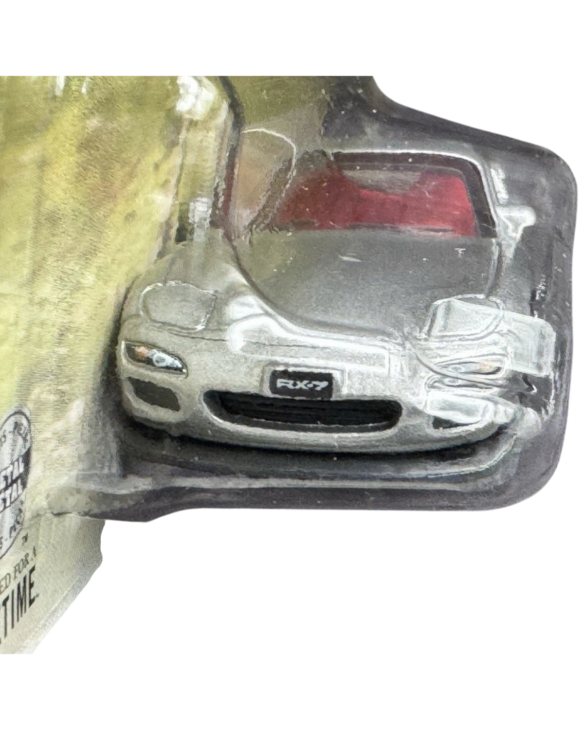 More Than Diecast silver 2002 Mazda RX-7 Spirit R die-cast car in blister packaging with red interior detail