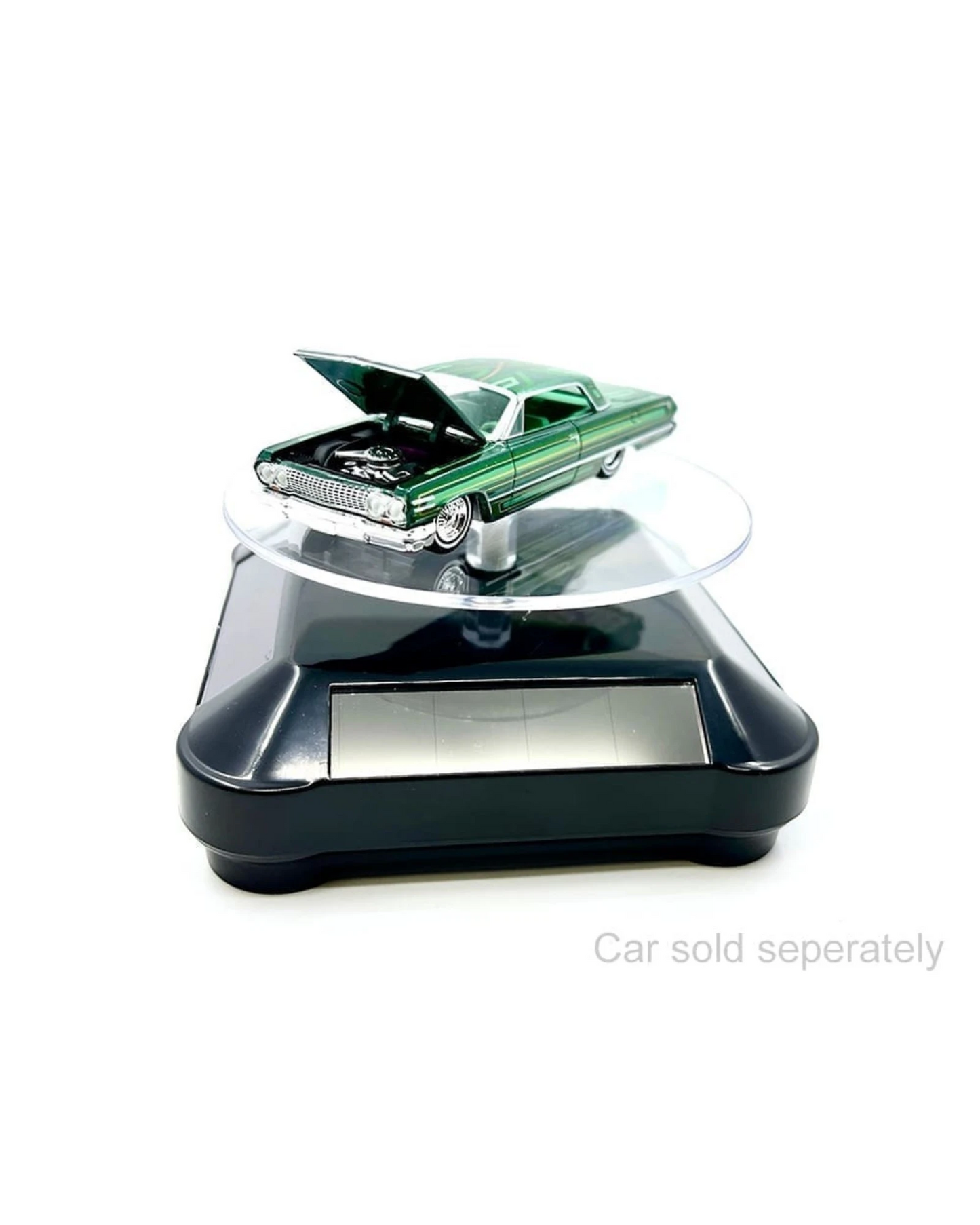 More Than Diecast solar powered 3.5" turntable display stand with black base, showcasing a 1:64 scale green die-cast car with hood open.