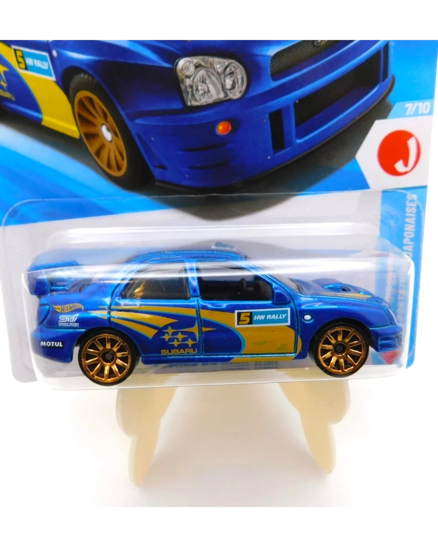 More Than Diecast Hot Wheels 2002 Subaru Impreza WRX in blue with gold wheels and rally graphics on blister card