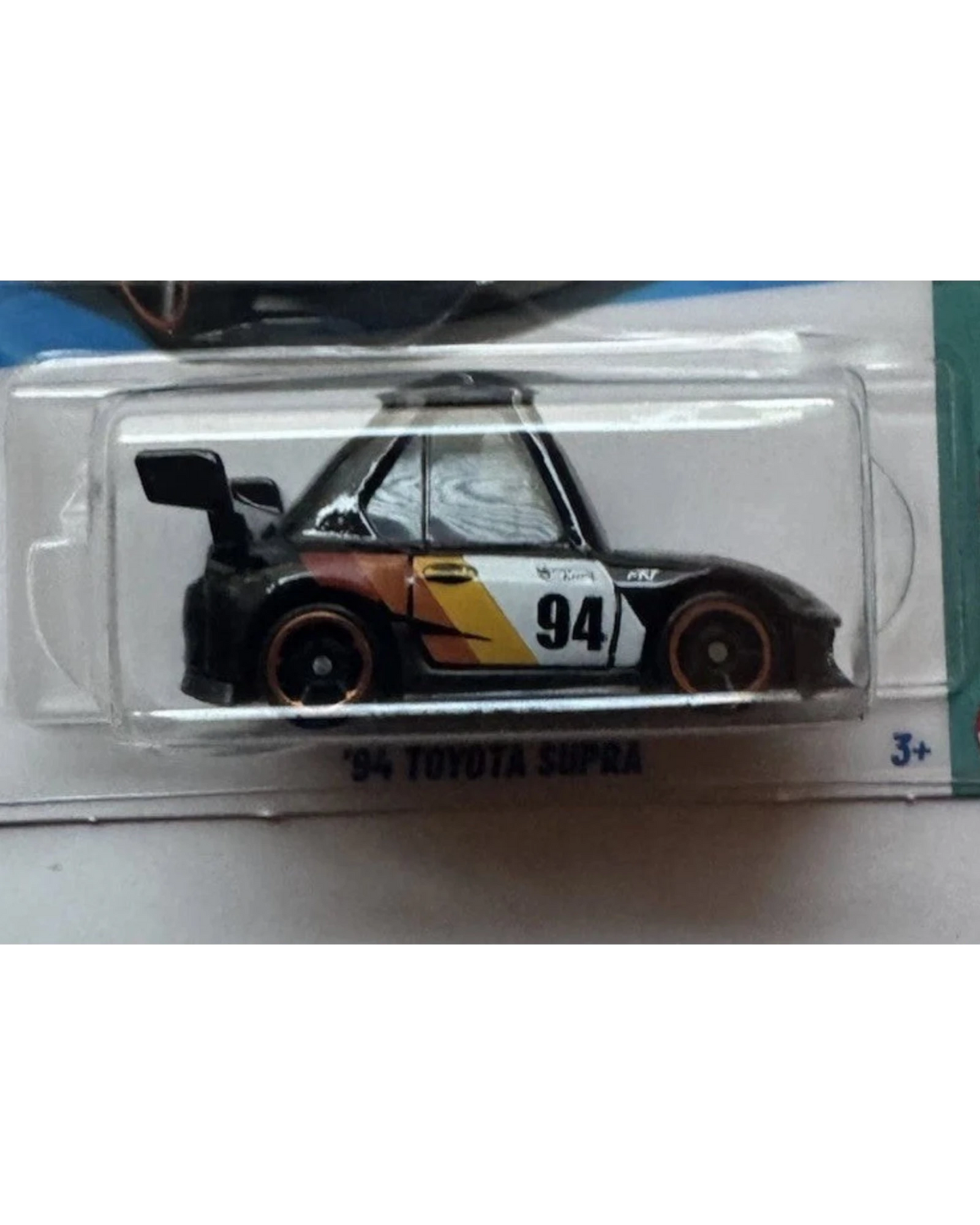 More Than Diecast Hot Wheels Tooned 94 Toyota Supra die-cast car in black with racing decals in original packaging