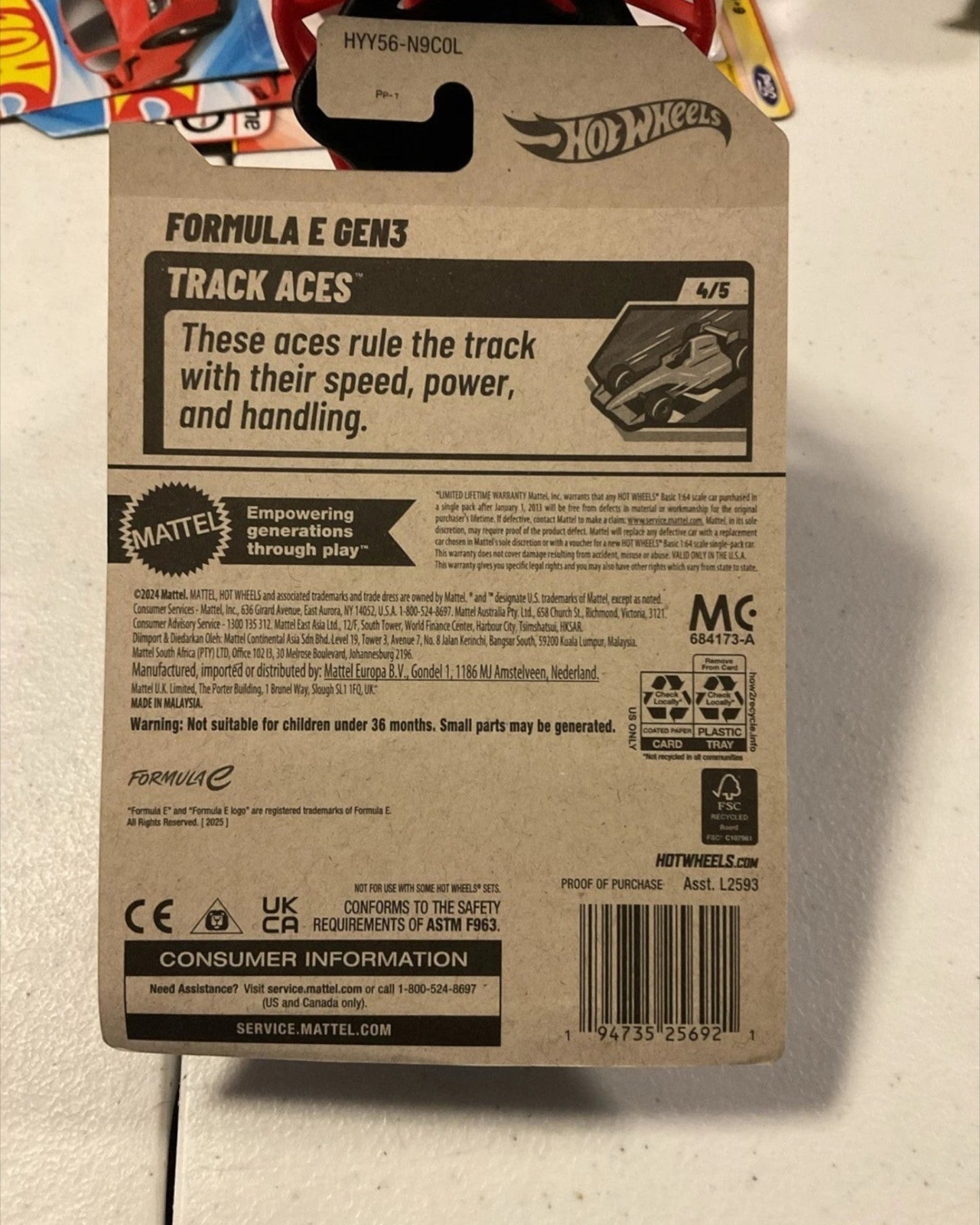 More Than Diecast 2025 Hot Wheels Neom McLaren Track Aces Formula E GEN3 die-cast car packaging. Black card with text and graphics.