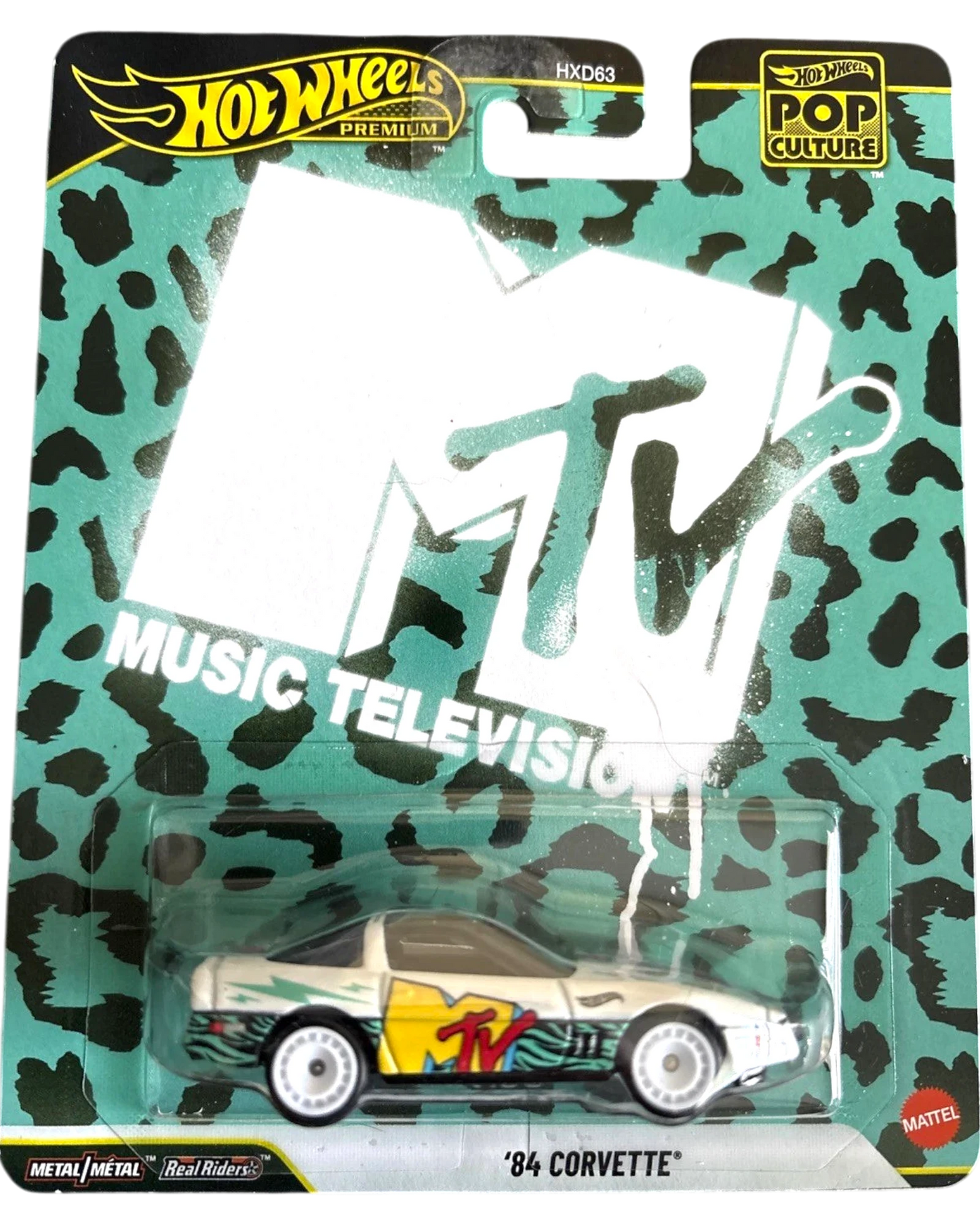 More Than Diecast Hot Wheels Premium Pop Culture 1984 Corvette with MTV Music Television graphics. White car with yellow and red MTV logo.