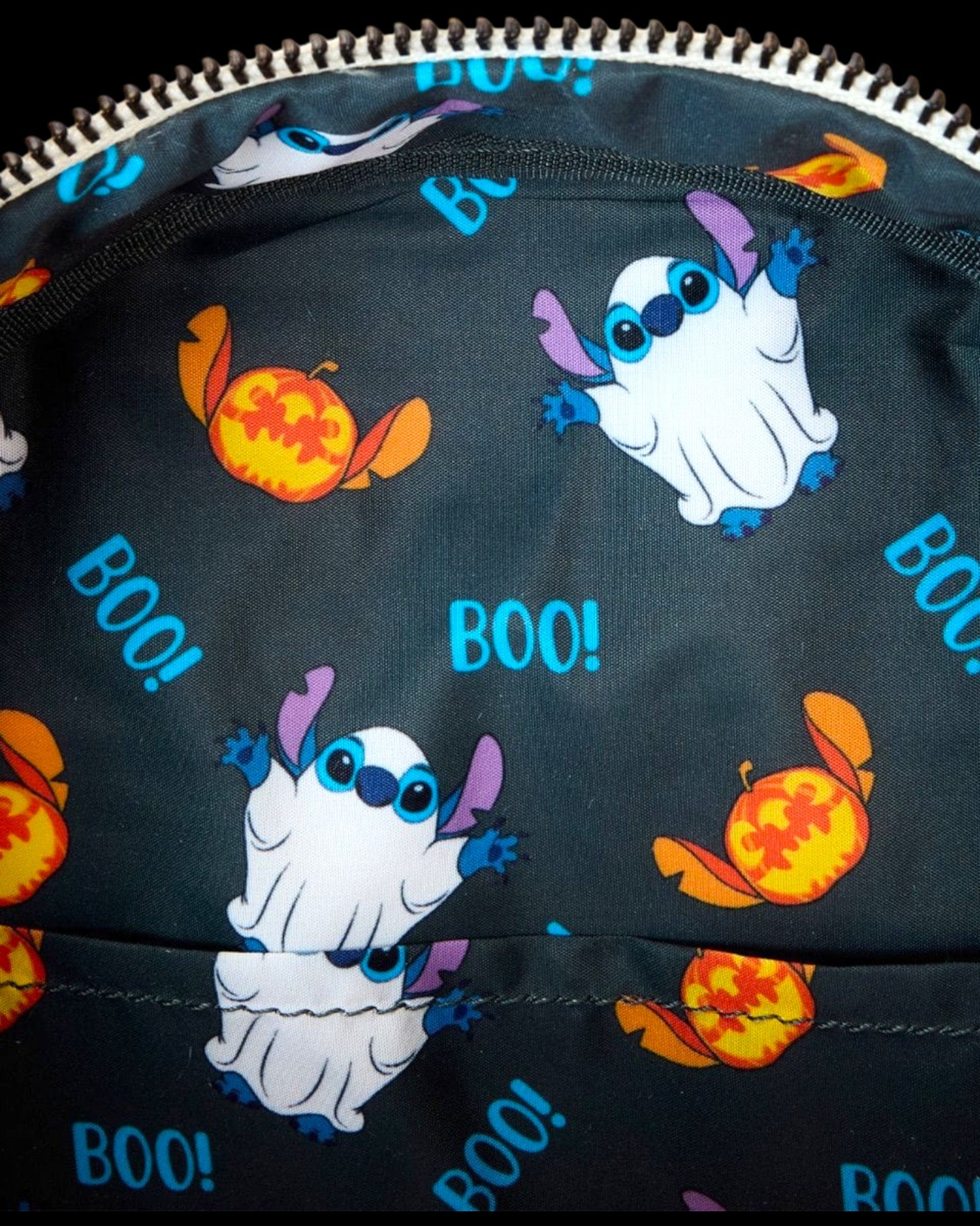 Loungefly Lilo & Stitch Ghost Cosplay mini-backpack with glow-in-the-dark finish and "BOO!" print.