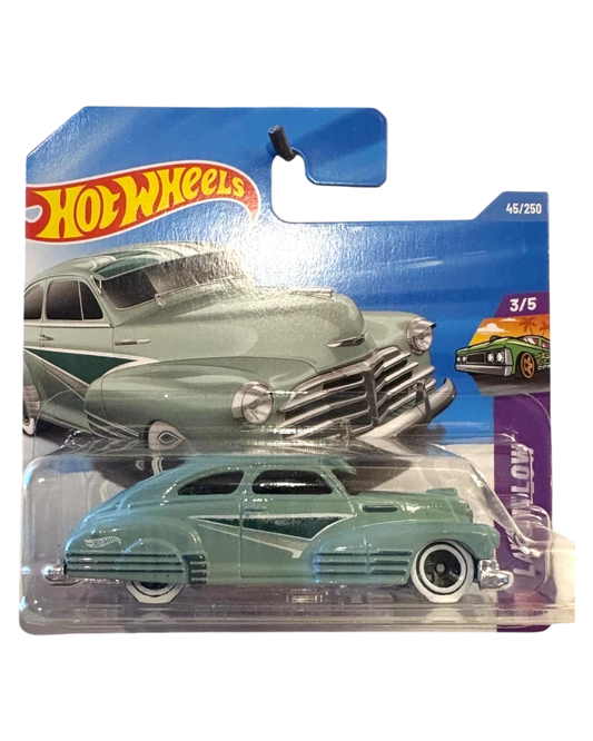More Than Diecast green 1947 Chevy Fleetline Hot Wheels toy car with white wall tires and dark green accents.