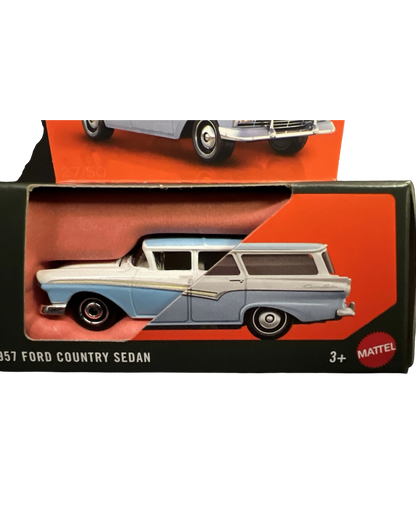 More Than Diecast 1957 Ford Country Sedan die-cast car in blue and white, featuring moving parts in original packaging.