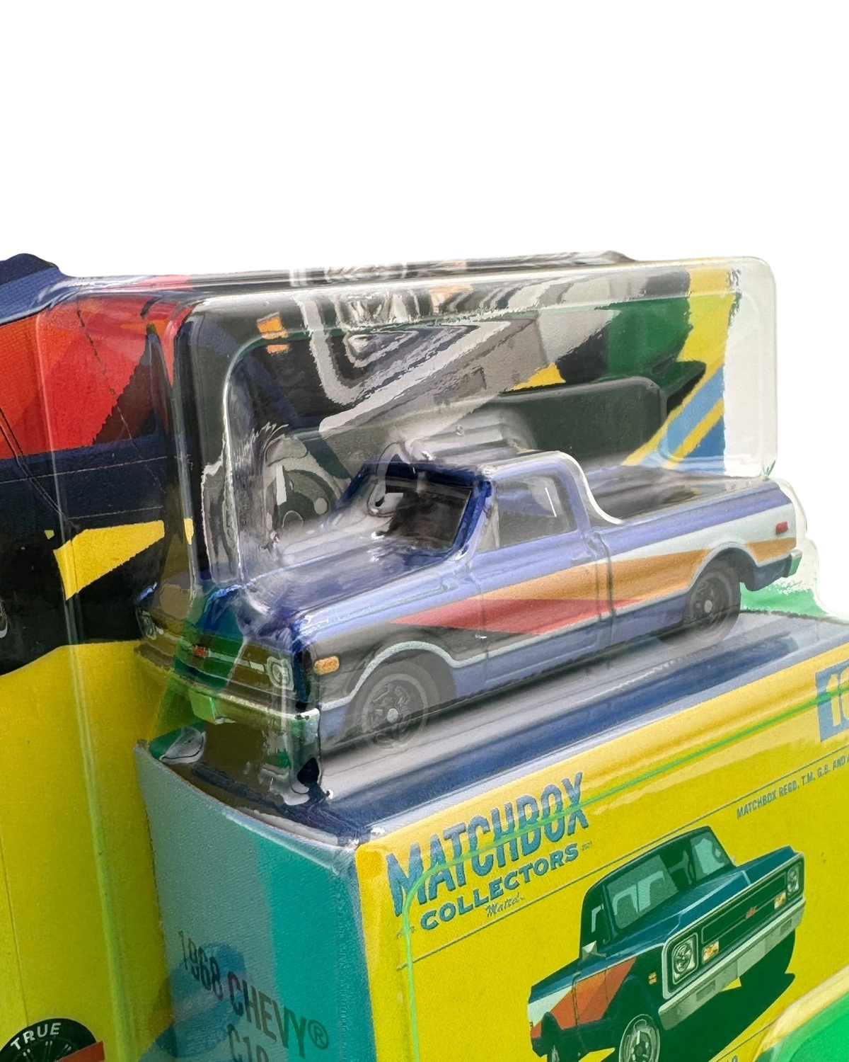 More Than Diecast 1968 Chevy C10 pickup truck in 1:64 scale, featuring blue paint with red and orange side stripes.