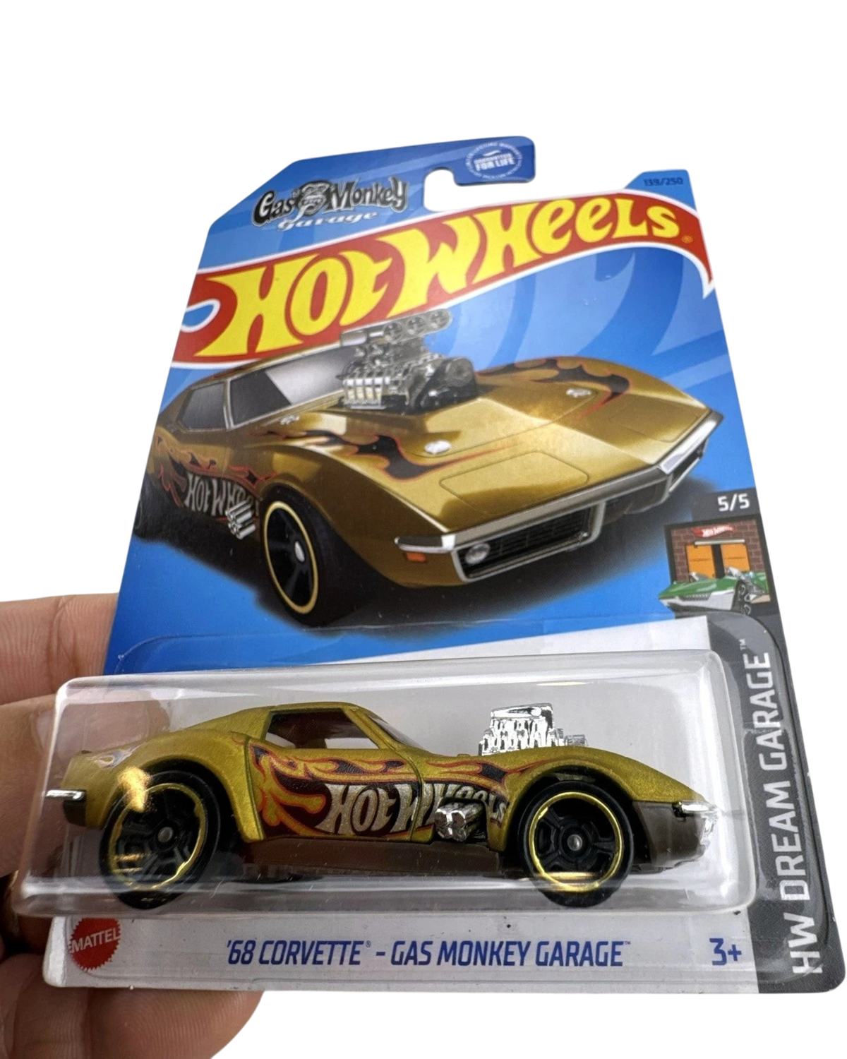 More Than Diecast Hot Wheels 1968 Corvette Gas Monkey Garage die-cast car in gold with flame decals in original packaging