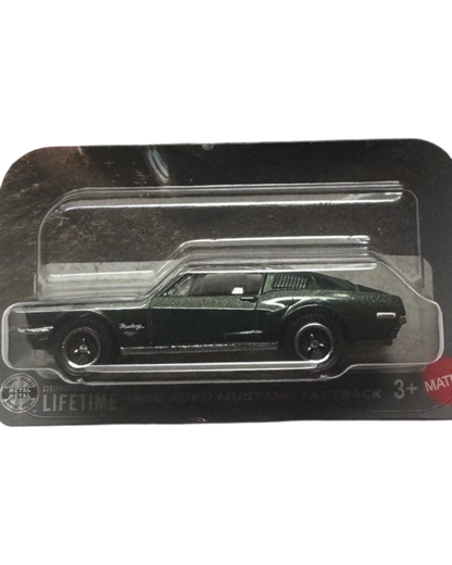 More Than Diecast 1:64 scale dark green 1968 Ford Mustang Fastback die-cast car in Matchbox The Movie packaging