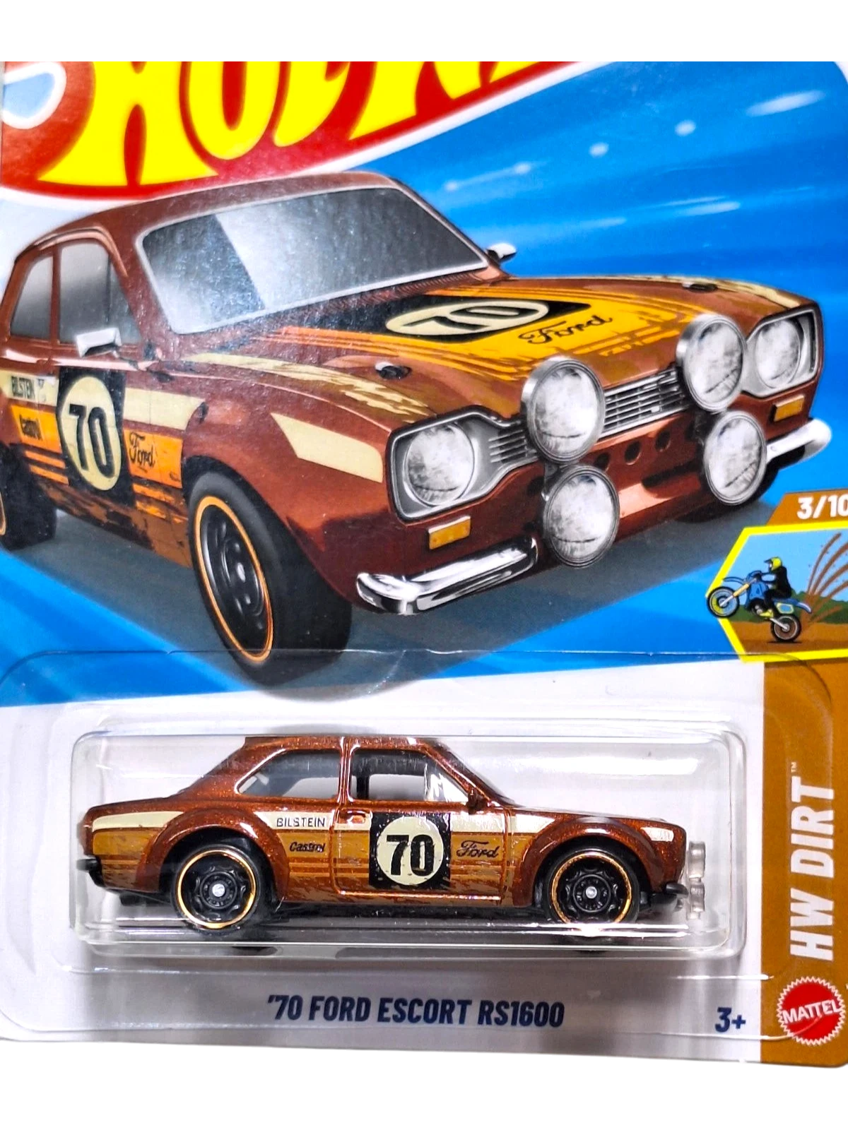 More Than Diecast 1:64 scale 1970 Ford Escort RS1600 HW Dirt series diecast car, metallic brown with racing decals and rally lights.