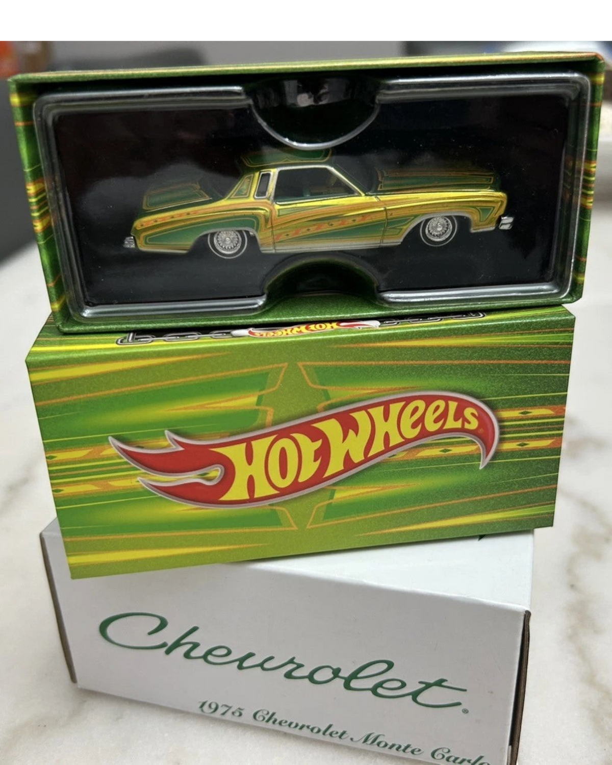 More Than Diecast Hot Wheels 1975 Chevrolet Monte Carlo RLC Exclusive lowrider in green and yellow packaging
