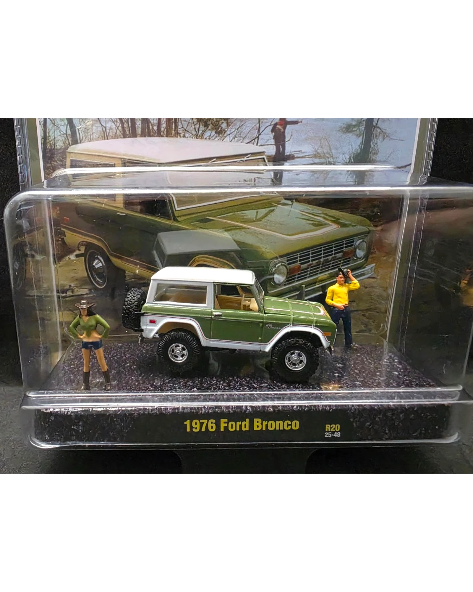 More Than Diecast 1:64 scale 1976 Ford Bronco diorama set with two figures in a clear display case