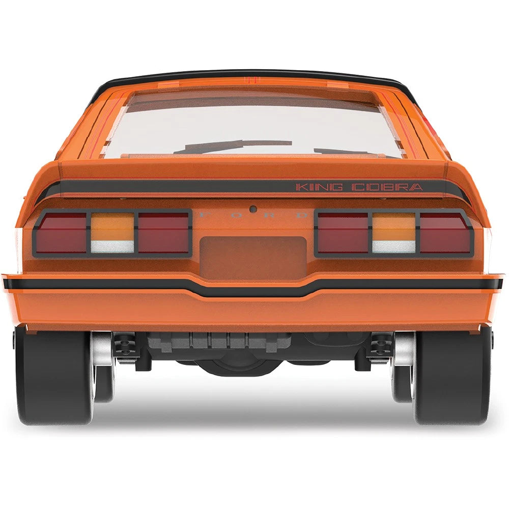 More Than Diecast 1978 Ford Mustang King Cobra II model car in tangerine and black, rear view showing spoiler detail.