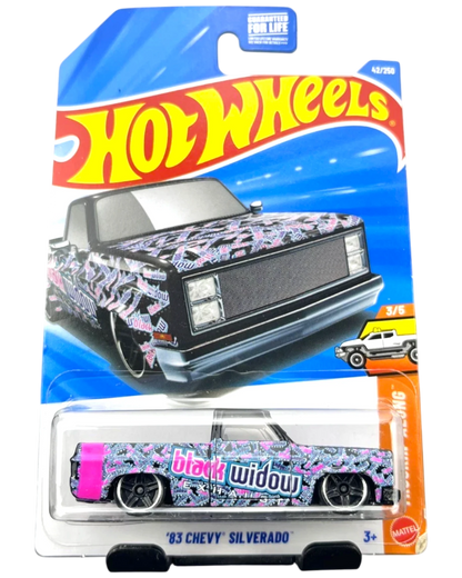 More Than Diecast 2026 Hot Wheels 1983 Chevy Silverado Black Widow toy truck, black with pink and blue graphic print.