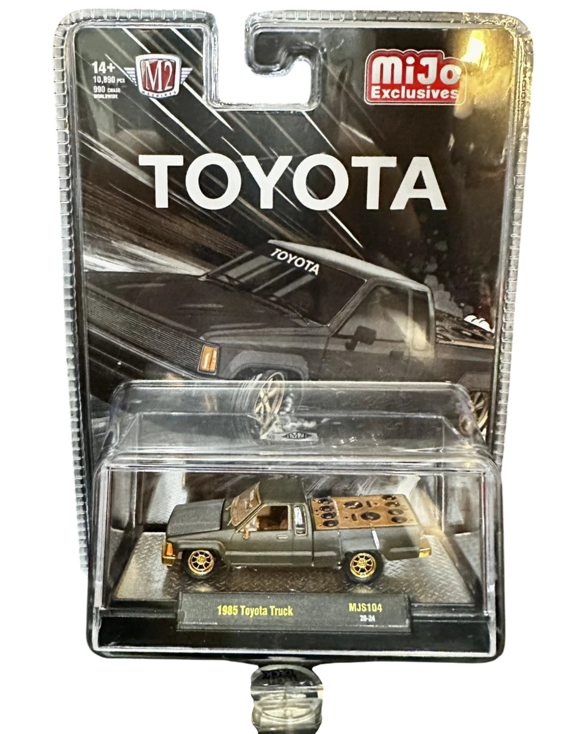 More Than Diecast M2 Machines 1985 Toyota Pickup Truck chase variant in matte grey with a slammed custom stance