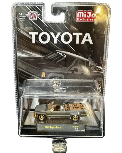 More Than Diecast M2 Machines 1985 Toyota Pickup Truck chase variant in matte grey with a slammed custom stance