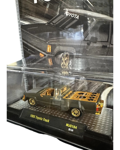 More Than Diecast 1985 Toyota Pickup Truck chase variant in matte grey with gold wheels and custom bed detail