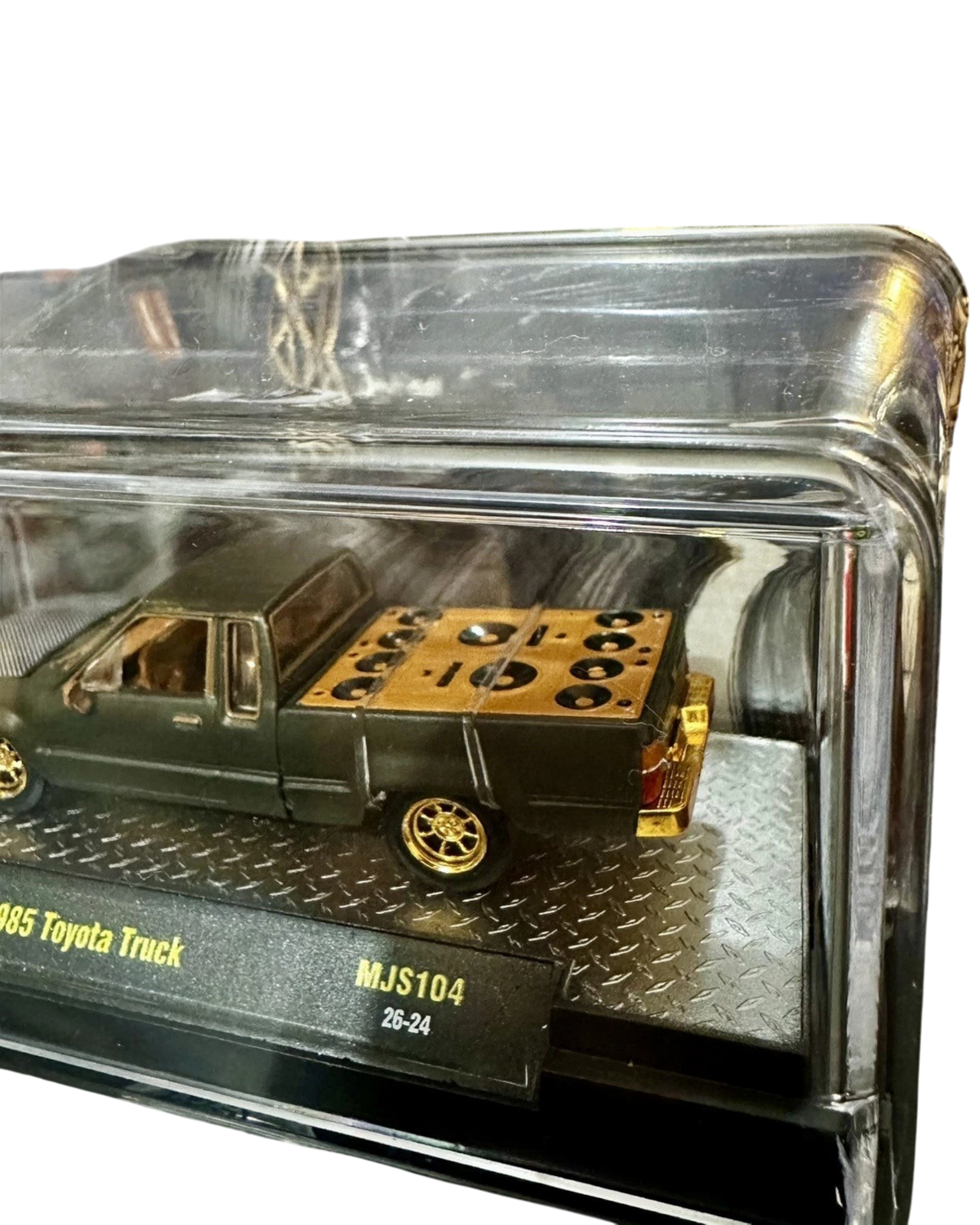 More Than Diecast M2 Machines 1985 Toyota Pickup Truck chase variant in matte grey with gold bed detail in display case