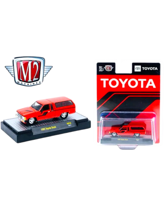 More Than Diecast M2 Machines 1985 Toyota Truck with camper shell in red, 1:64 scale die-cast model on display base.