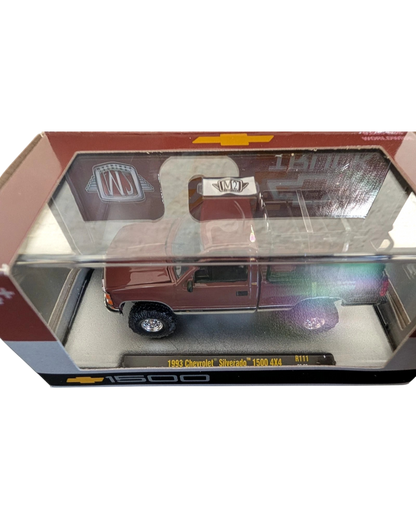 More Than Diecast 1:64 scale 1993 Chevrolet Silverado 1500 4x4 die-cast truck in a maroon finish inside display box