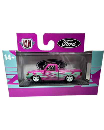 More Than Diecast 1:64 scale 1995 Ford Ranger in pink and blue two-tone livery with custom flame graphics in packaging