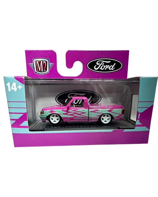 More Than Diecast 1:64 scale 1995 Ford Ranger in pink and blue two-tone livery with custom flame graphics in packaging