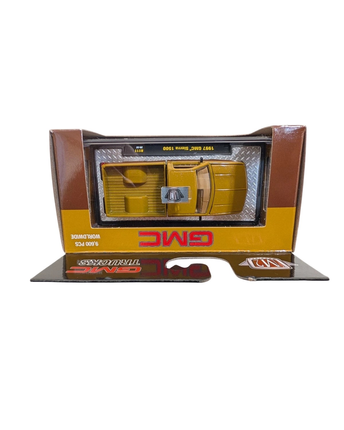 More Than Diecast 1:64 scale 1997 GMC Sierra 1500 die-cast truck in brown and tan two-tone finish in original packaging