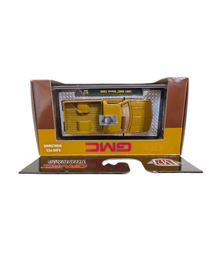 More Than Diecast 1:64 scale 1997 GMC Sierra 1500 die-cast truck in brown and tan two-tone finish in original packaging