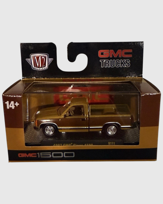 More Than Diecast 1:64 scale 1997 GMC Sierra 1500 die-cast truck in a two-tone brown and tan factory-era finish.