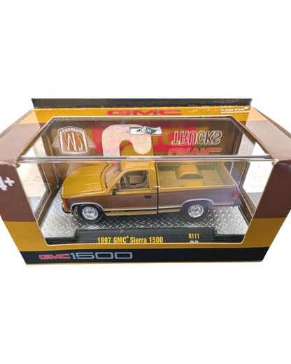 More Than Diecast M2 Machines 1:64 scale 1997 GMC Sierra 1500 truck in a two-tone brown and tan finish in packaging.