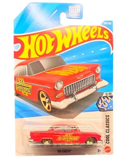 More Than Diecast Hot Wheels 55 Chevy die-cast car in red with yellow flame decals and gold wheels in blister pack