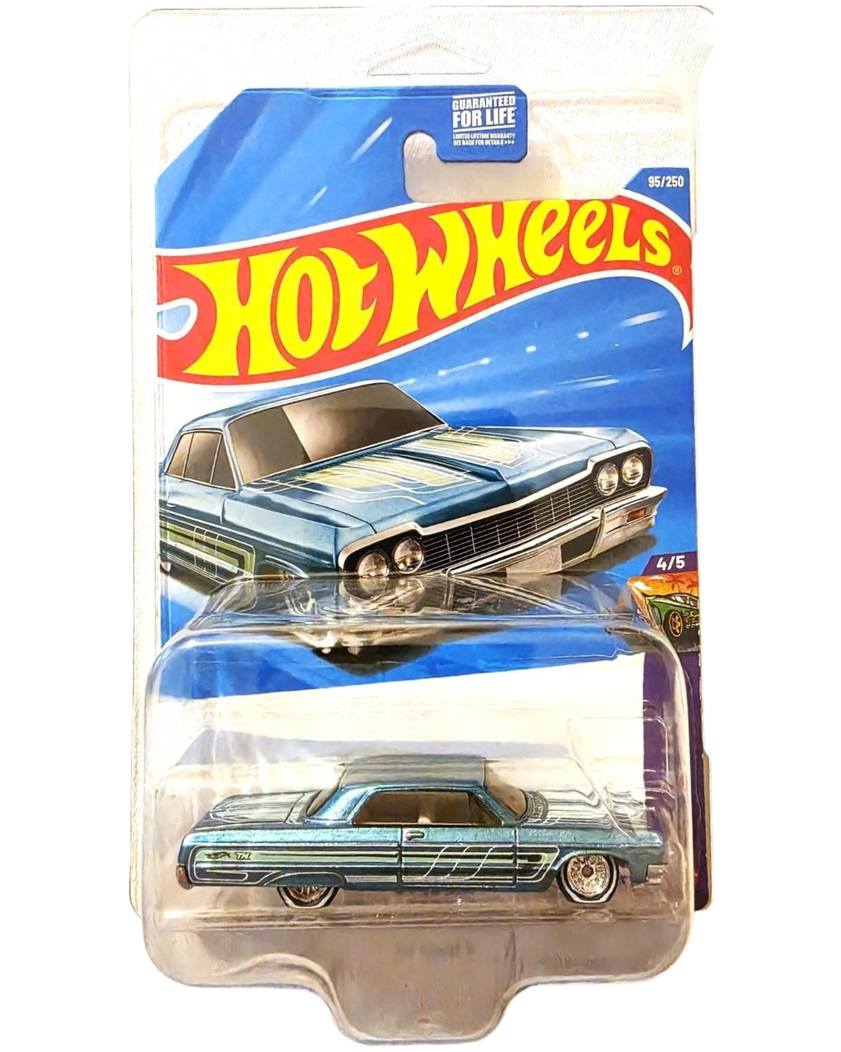 More Than Diecast 2026 Hot Wheels '64 Chevrolet Impala Super Treasure Hunt in blue with custom graphics in packaging