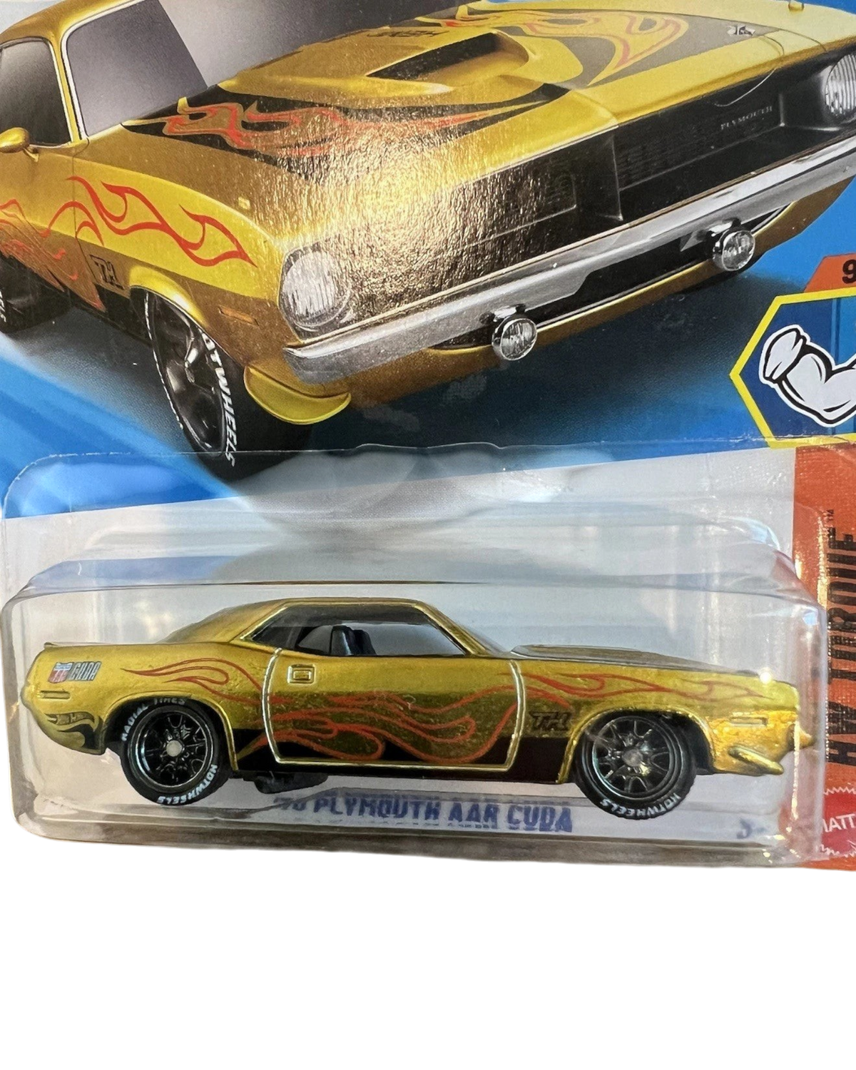 More Than Diecast 2026 Hot Wheels Super Treasure Hunt 70 Plymouth AAR Cuda in gold with flame decals and Real Riders.