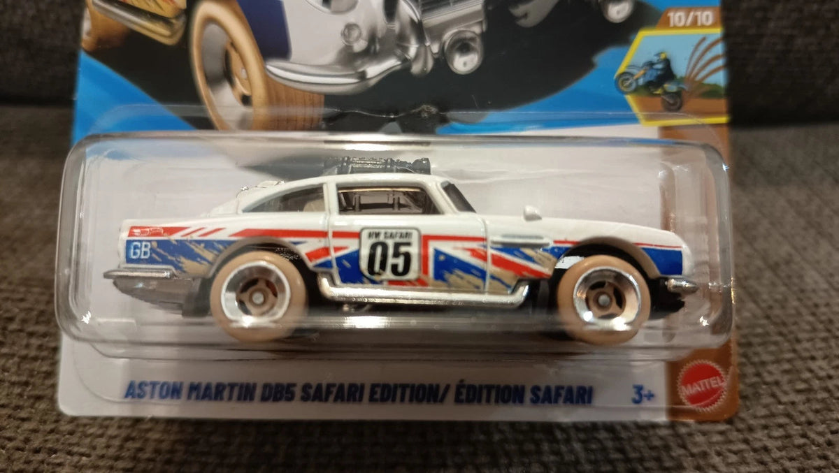 More Than Diecast Hot Wheels Aston Martin DB5 Safari Edition in white with Union Jack graphics and off-road tires.