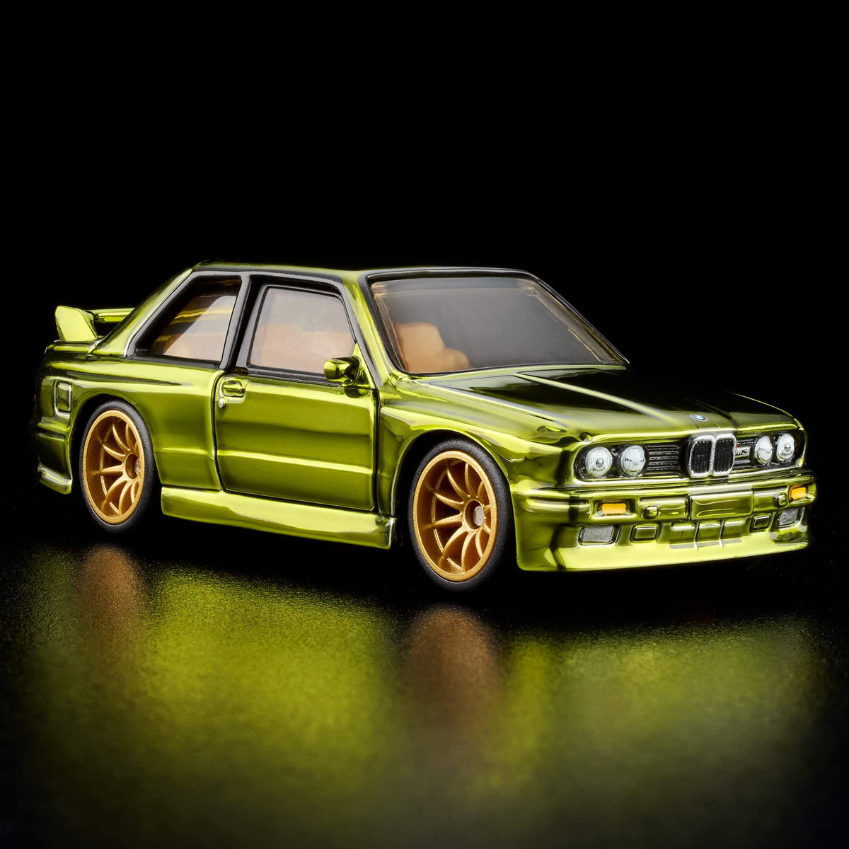 More Than Diecast Hot Wheels RLC 1991 BMW M3 in Spectraflame olive with gold 10-spoke wheels and tan interior.
