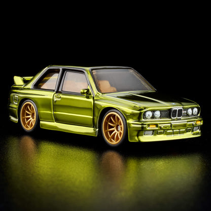 More Than Diecast Hot Wheels RLC 1991 BMW M3 in Spectraflame olive with gold 10-spoke wheels and tan interior.