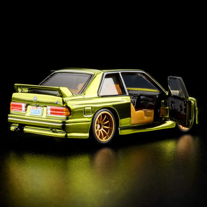More Than Diecast 1:64 scale 1991 BMW M3 in Spectraflame olive with opening doors and metallic-gold 10-spoke wheels.