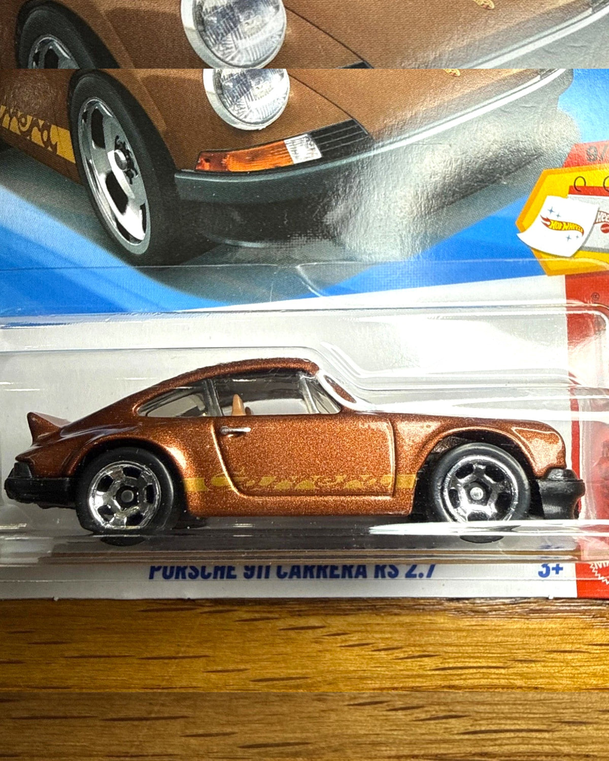 More Than Diecast Hot Wheels brown Porsche 911 Carrera RS 2.7 die-cast car with iconic ducktail spoiler in packaging