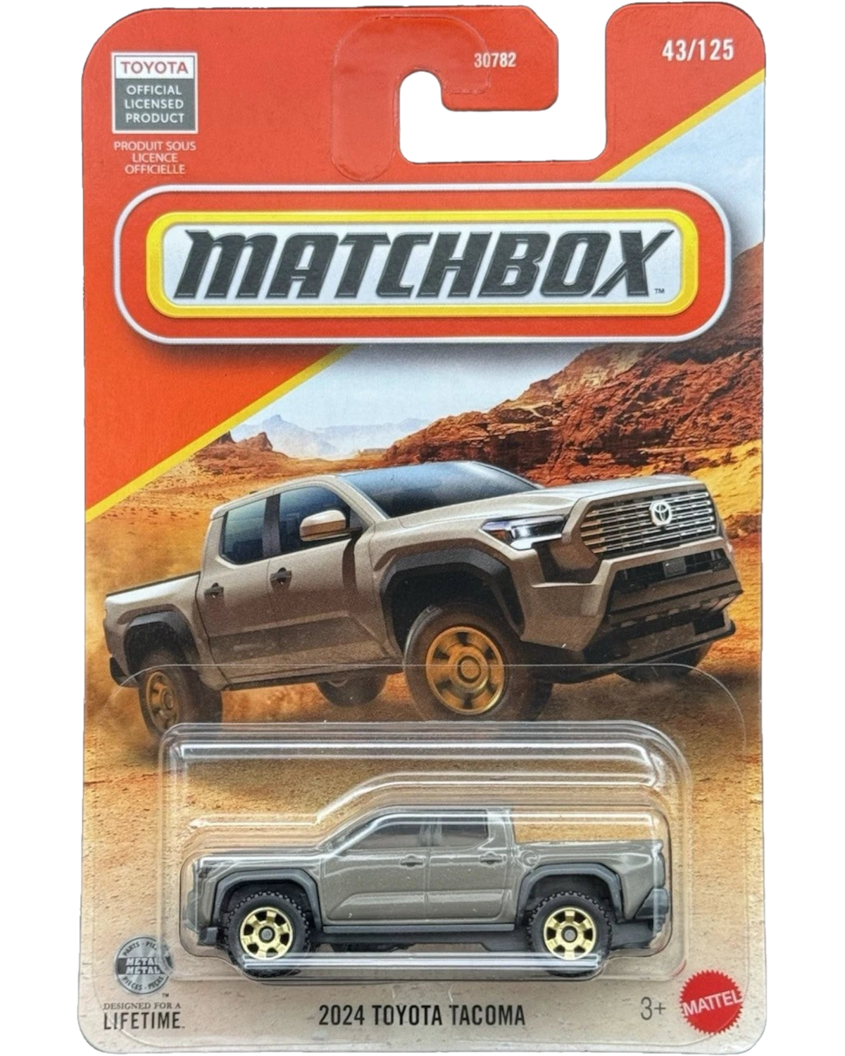 More Than Diecast 1:64 scale brown 2024 Toyota Tacoma die-cast truck in original Matchbox blister card packaging