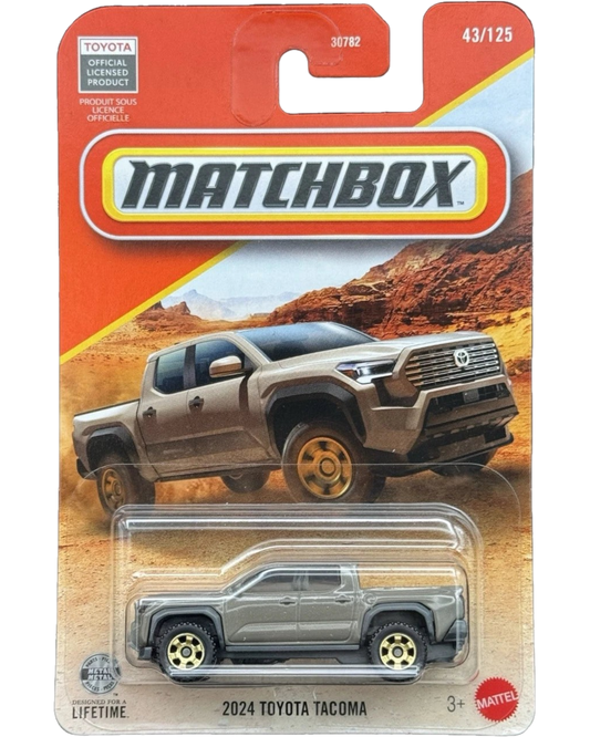 More Than Diecast 1:64 scale brown 2024 Toyota Tacoma die-cast truck in original Matchbox blister card packaging