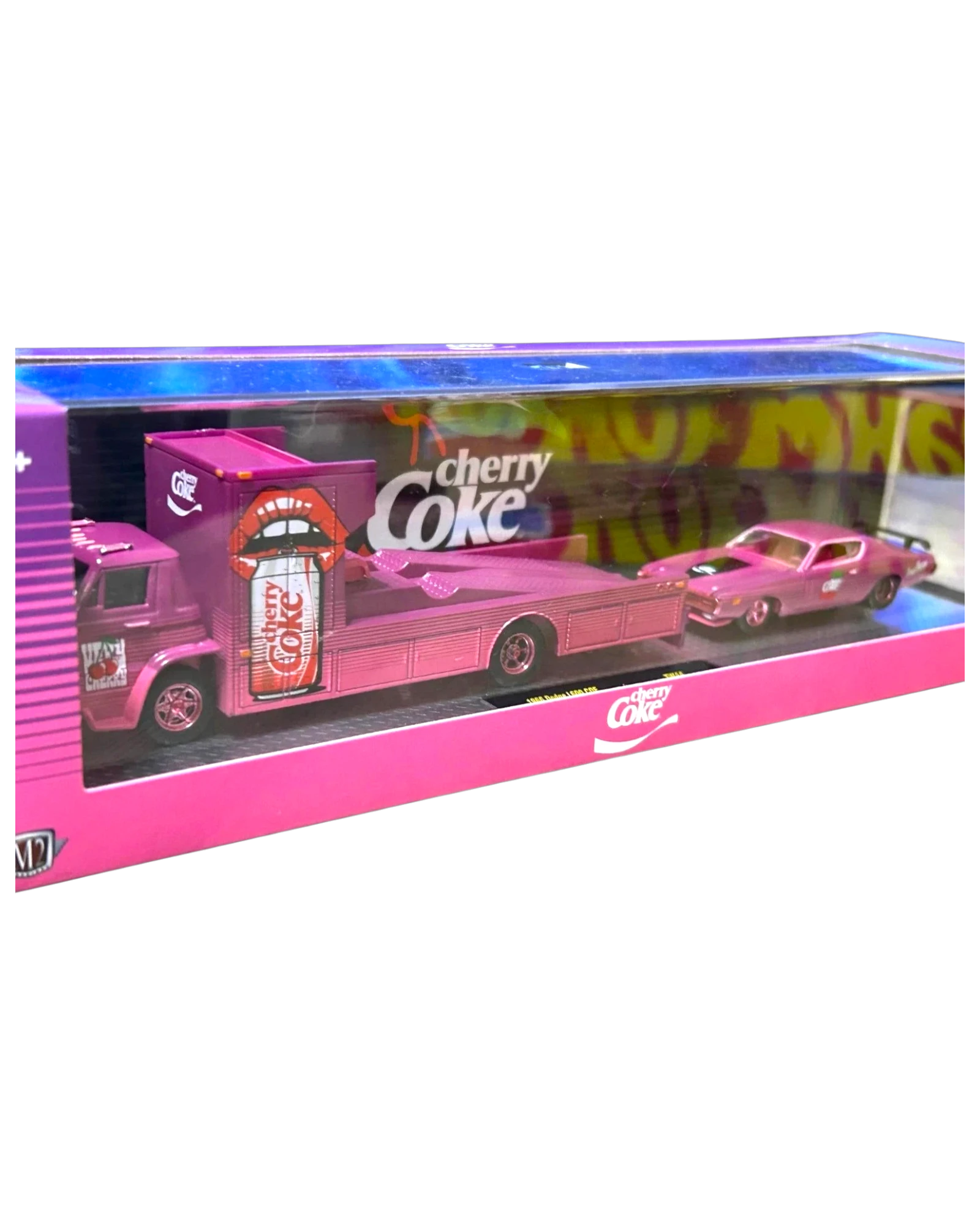 More Than Diecast M2 Machines Cherry Coke 1966 Dodge L600 hauler and 1971 Dodge Charger die-cast set in pink packaging.