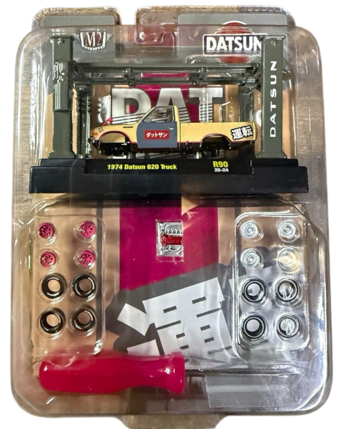 More Than Diecast M2 Machines 1974 Datsun 620 pickup truck model kit with extra wheels and tools in blister packaging