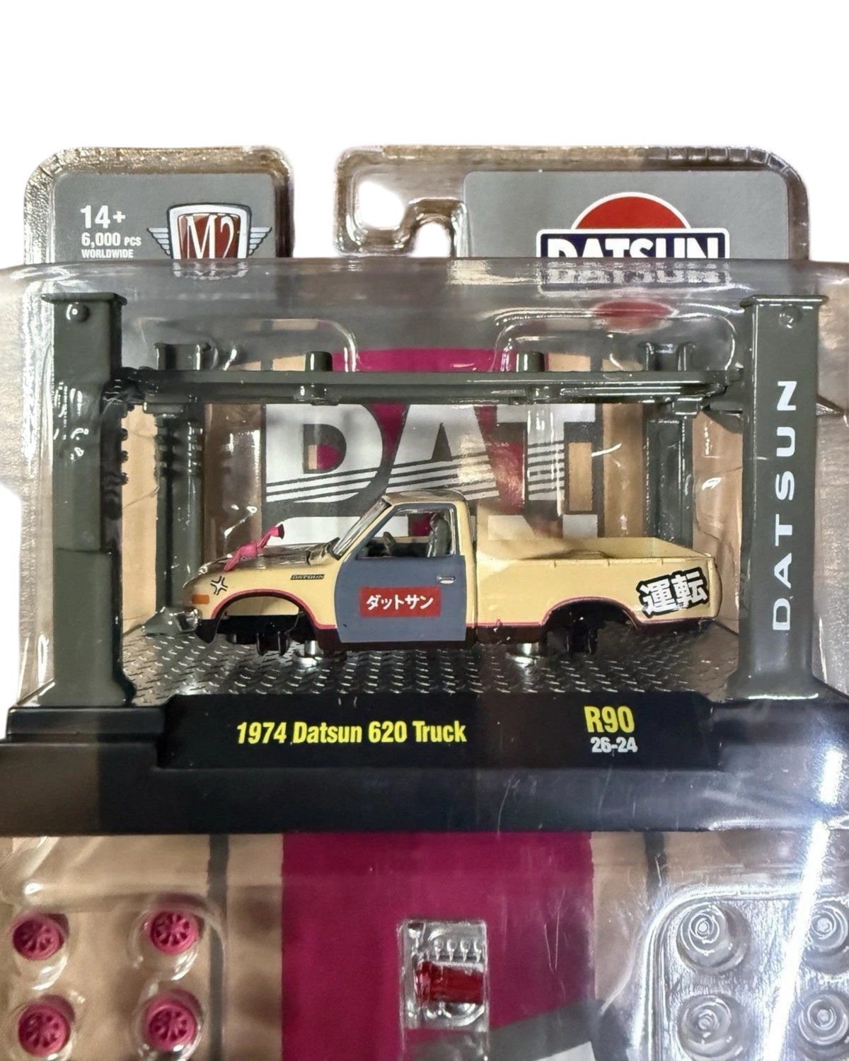More Than Diecast 1:64 scale 1974 Datsun 620 pickup truck model kit in beige and blue with Japanese text decals