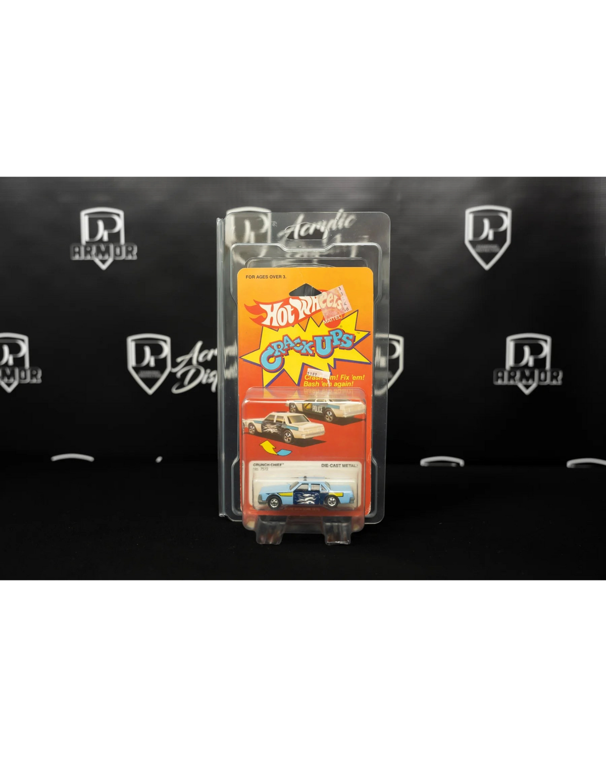More Than Diecast Diamond dual-card protector holding a vintage Hot Wheels Crack-Ups toy car in clear protective PVC